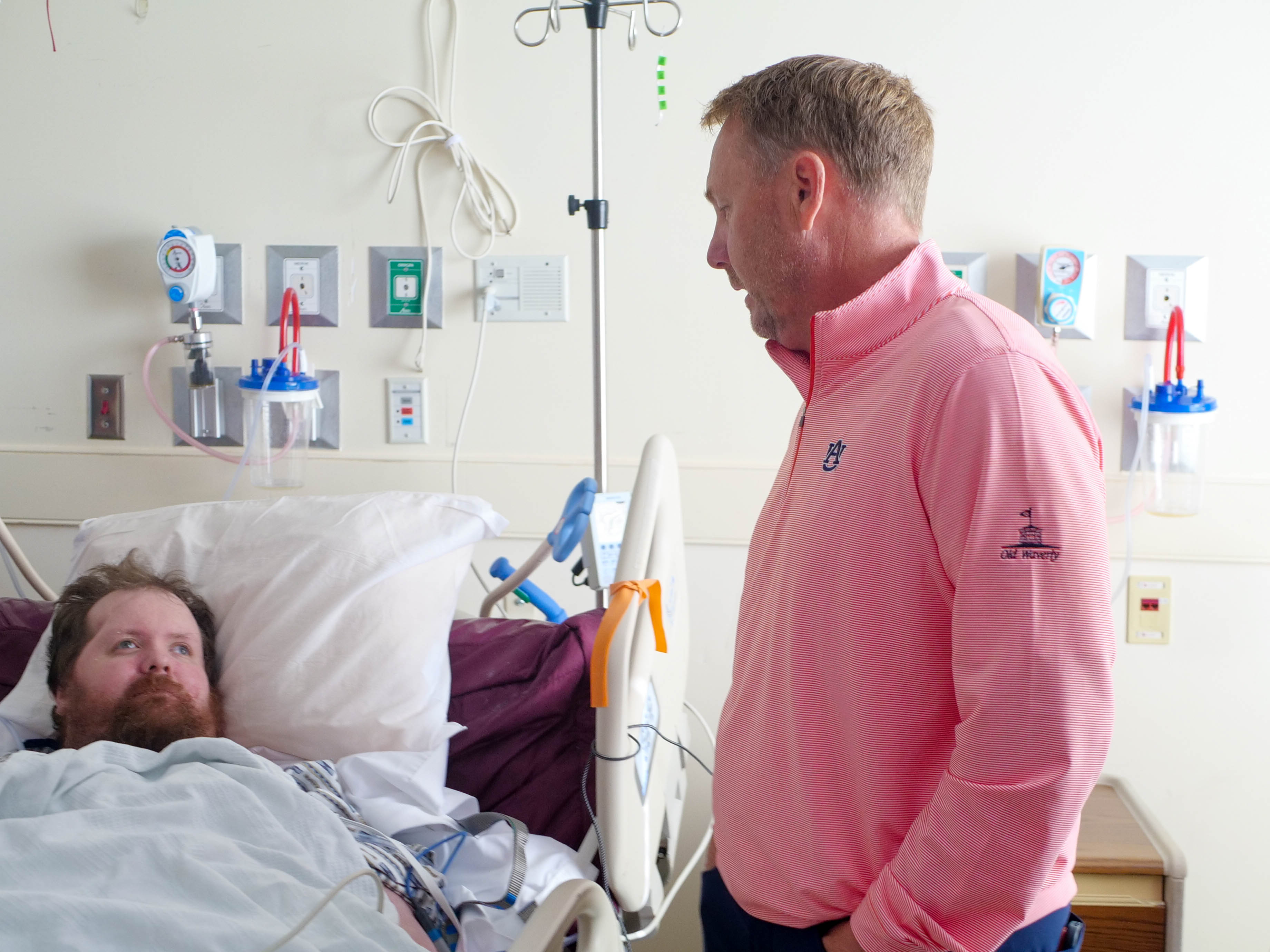 Hugh Freeze speaks with a patient at EAMC.
